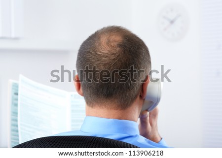 Banking. Businessman with telephone in the office