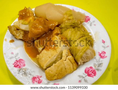 Japanese oden. vegetables, fish dumplings and various other articles of food stewed in a thin soy soup