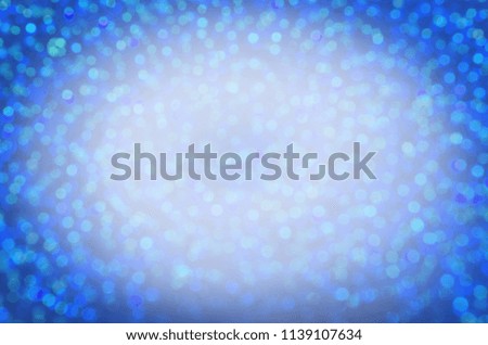 Glittering blue background. Abstract blue bokeh background. Copy space for your text