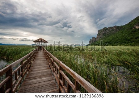 Wooden bridge over a lake in Sam Roi Yod National Park, Prachuap Khiri Khan, Thailand