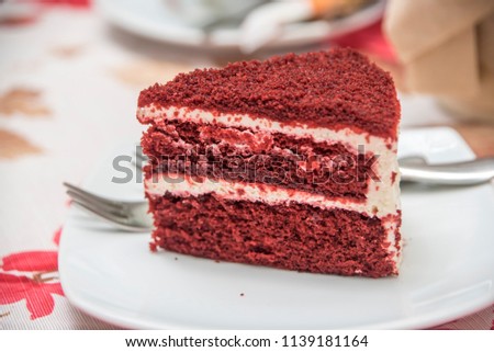 Delicious cake on plate on table on light background