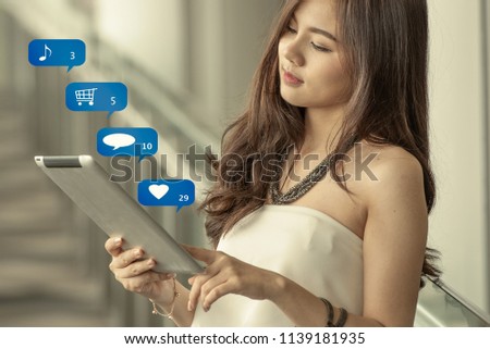 Asian woman using tablet computer, social media, chat, shopping, texting, love,  online shopping, check mail, searching, typing message.