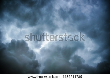 Black cloud and thunderstorm before rainy, Dramatic black clouds and dark sky.