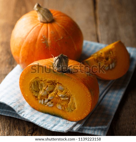 Fresh pumpkin on desk