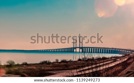 Panoramic View to the Oresund Bridge in the Eveneing, Sweden and Denmark Royalty-Free Stock Photo #1139249273