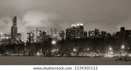 Central Park winter at night panorama with skyscrapers in midtown Manhattan New York City