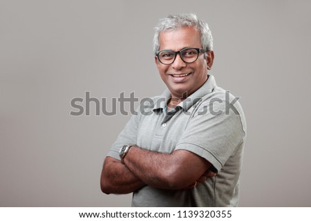 Middle aged man with pleasant face expression Royalty-Free Stock Photo #1139320355