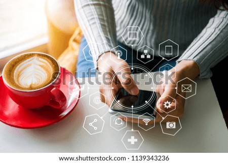  businesswoman working with mobile phones  and business strategy icons in the morning.