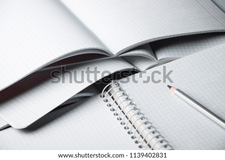 The pencil lies on the pages of the paper. Opening notebook. Training. September 1. Day of knowledge.