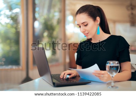Woman Reading an Important Document while Typing on Laptop. Busy businesswoman analyzing paper documents 
 Royalty-Free Stock Photo #1139422085