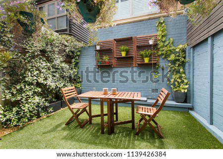back yard with outdoor seating and barbecue with family. beautiful house