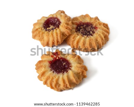 Kurabie shortbread cookie in the shape of a flower, with jam in the middle, isolated on a white background
