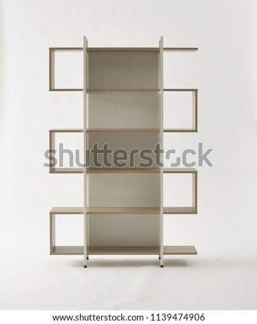 Empty white wood and steel bookshelf isolated on white. minimalism design furniture