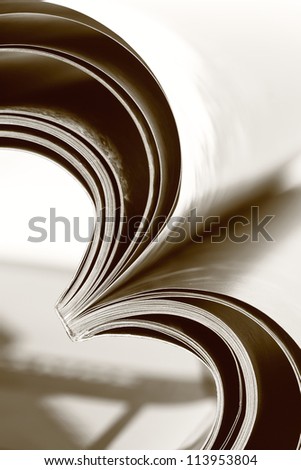 Selective focus image of magazine folded into a heart shape