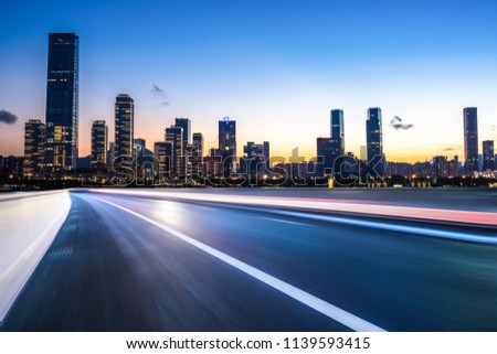 busy traffic road with city skyline in shenzhen china