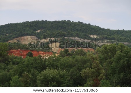 Rustrel, France – July 14, 2018: photography showing a magnificent landscape. The photography was taken from the town of Rustrel while hiking in the provencal colorado in the south of France.