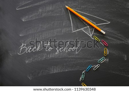 Top view image of plane sketch over classroom blackboard background