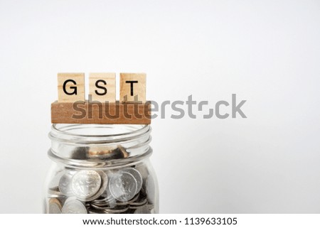 Government service tax or GST with a jar of coins