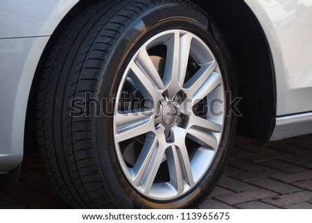 Car wheel on a car Royalty-Free Stock Photo #113965675