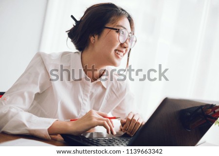 Shot of an attractive businesswoman working on laptop in her workstation.