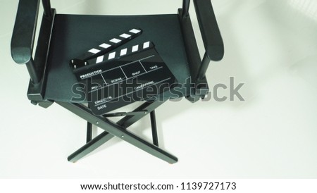 Clapperboard or clap board or slate with black director chair use in video production or movie ,film, cinema industry on white background.