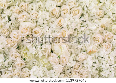 Many artificial white roses, hydrangea, peonies flower as background and decoration, stock photo image