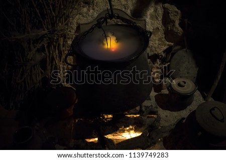 Magic cauldron with witchcraft smoke, special effects