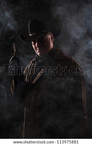 Man in darkness with razor