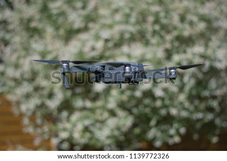 Drone in air tree green background