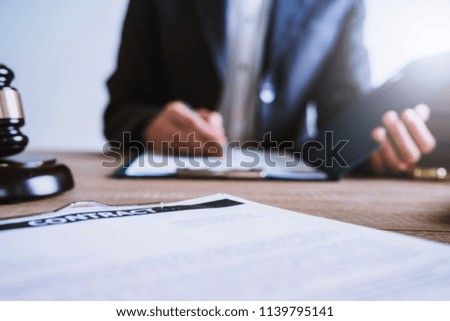 Lawyer business women working and writting in notebook on desk at office. consultant lawyer, justice and law ,attorney, court judge, concept.