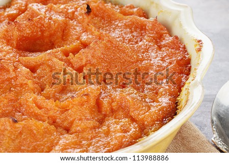 Sweet potato casserole. Extreme shallow depth of field with selective focus on center on potatoes.