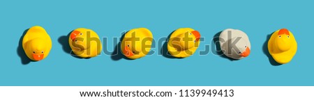 One out unique rubber duck concept on a blue background Royalty-Free Stock Photo #1139949413