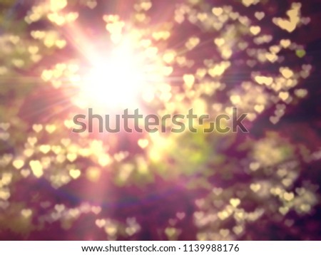 Golden heaven splashing light in Hope concept abstract blurred background from nature with sun splash and gold leaves for ramadan month