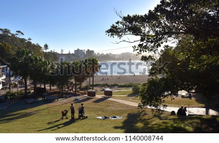 Shelly Beach and Cabbage Tree Bay Aquatic Reserve at Manly with sand and Tasman Sea. People relaxing on sandy Shelly beach at Manly. Royalty-Free Stock Photo #1140008744