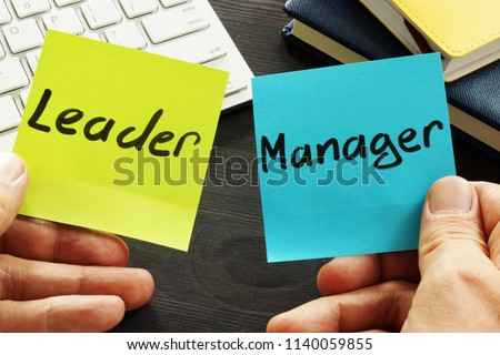 Leader vs manager. Man is holding memo sticks.