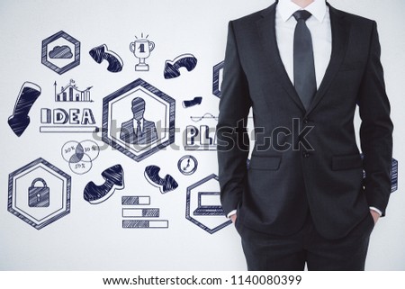 concept of small business planning with headless businessman and startup idea sketch at background