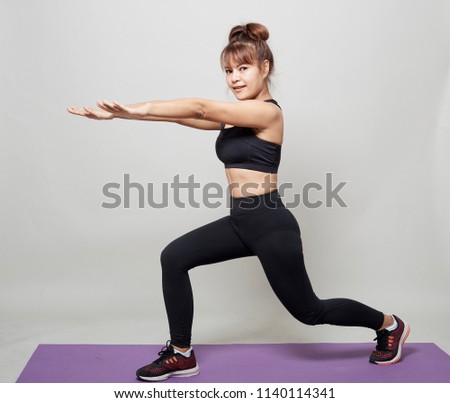 Stretching workout posture by a asian woman on studio gray background