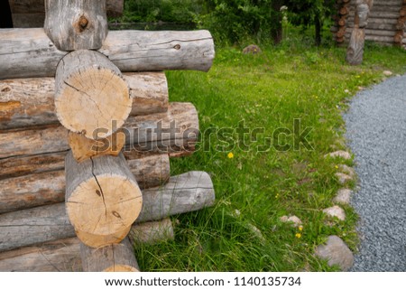 The corner of the wooden log cabin.