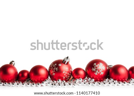 red christmas balls on white. studio shot