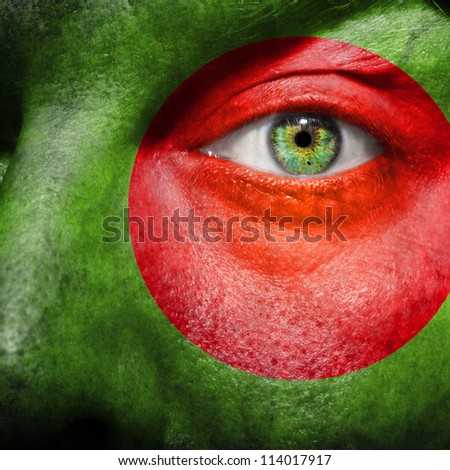 Flag painted on face with green eye to show Bangladesh support