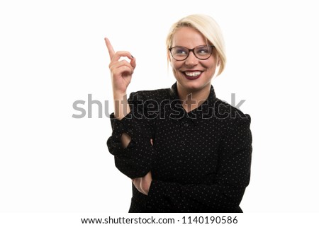Portrait of young blonde female teacher wearing glasses pointing finger up gesture isolated on white background with copyspace advertising area