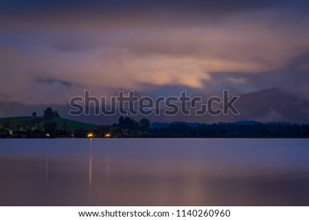 Nightfall at lake Hopfensee in the Alps of Bavaria