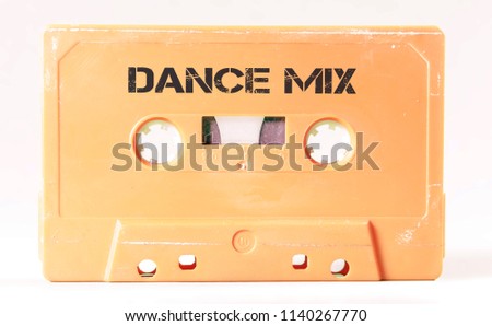 A vintage cassette tape from the 1980s era (obsolete music technology) with the text Dance Mix (my addition, not in the original image). Color: cream, salmon. White background.
