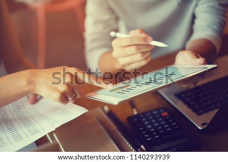 close up ceo businesswoman hand point on dashboard screen tablet device for ask and share idea or consulting with businessman partner for business team and work from home concept Royalty-Free Stock Photo #1140293939