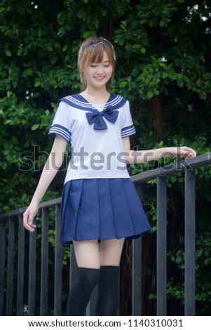 Portrait of thai teen beautiful girl in japanese student uniform happy and relax