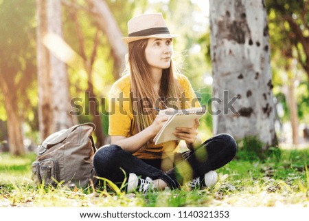 Girl drawing in the park