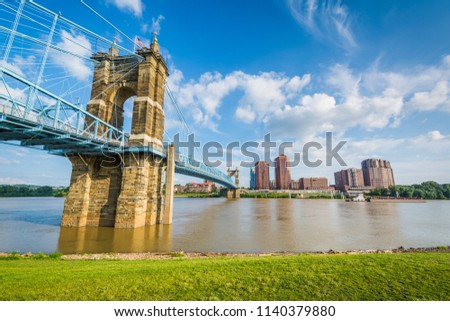 The Covington skyline and John A. Roebling Suspension Bridge, seen from Smale Riverfront Park, in Cincinnati, Ohio.