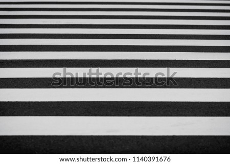 Crosswalk in Black and white on the asphalt road. Pedestrian on the road