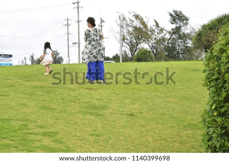 travel in japan, Okinawa, the weather is clear, travel landscape, mother and 
daughter