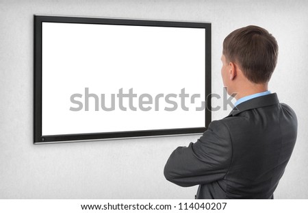 Business man looking on the empty screen